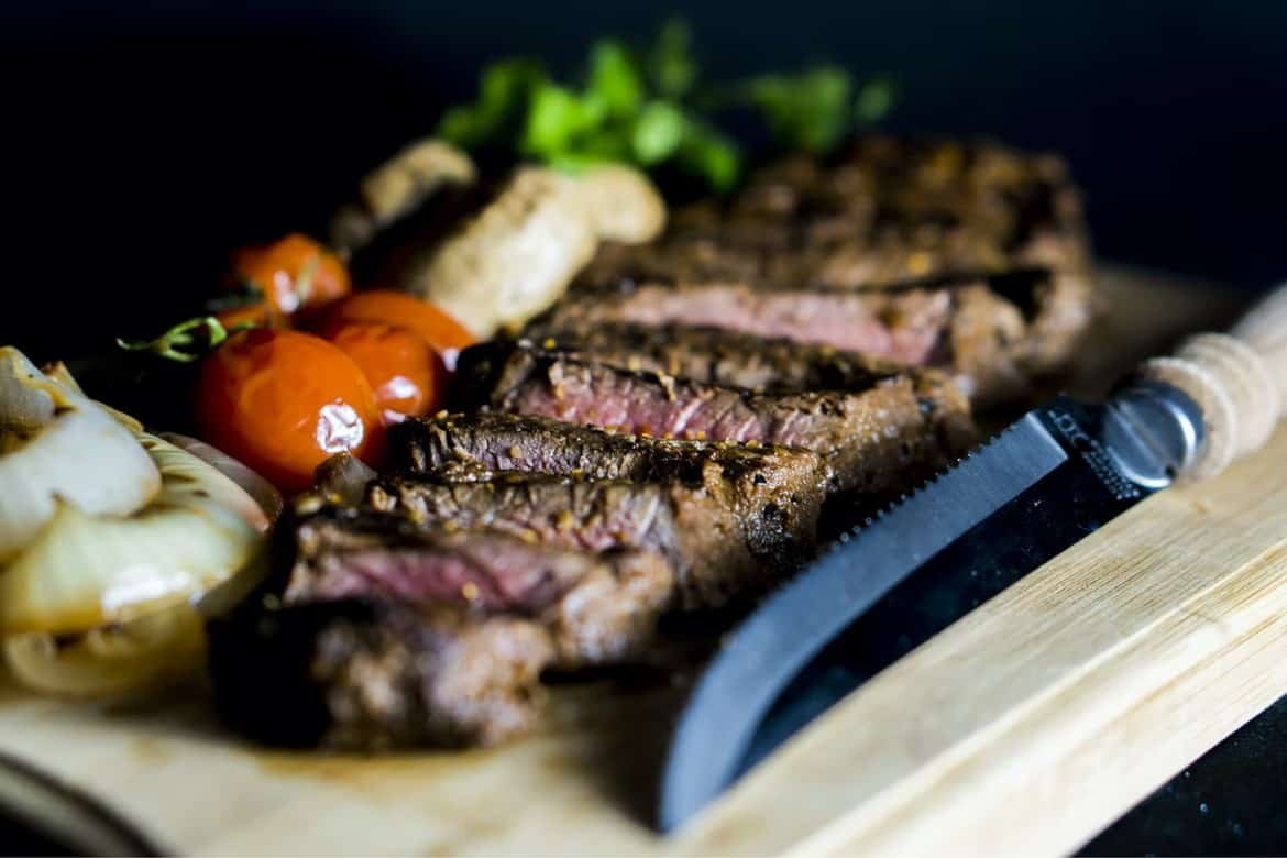 knife with steak on board
