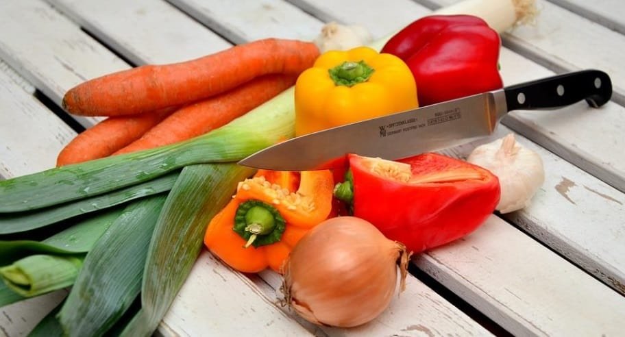 knife cutting vegetables