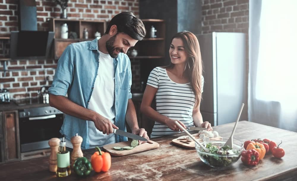 couple is cooking on kitchen