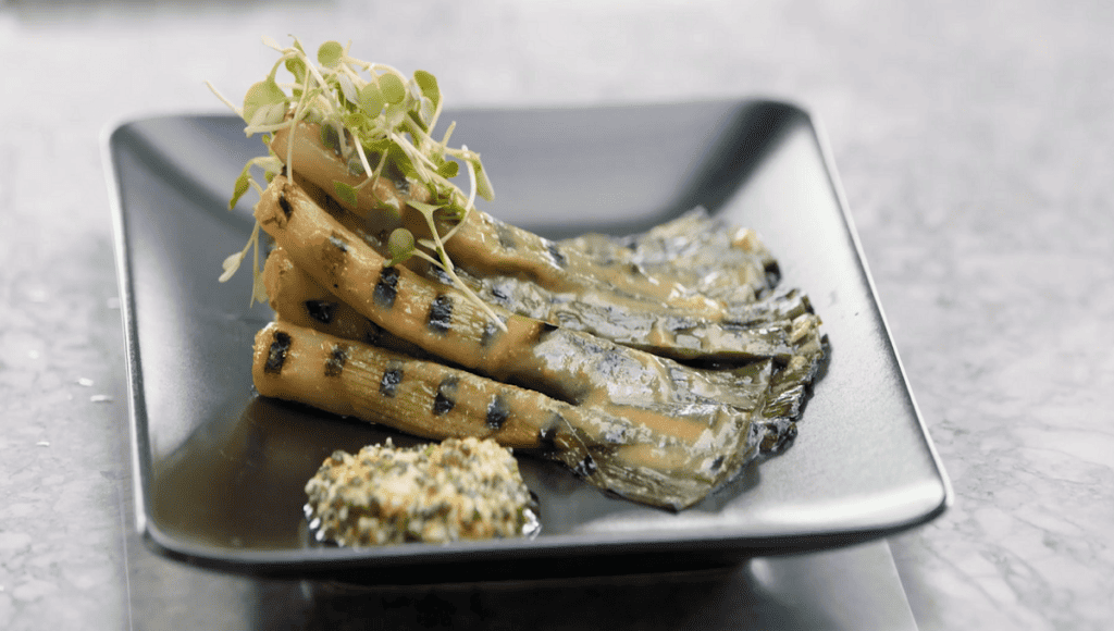 Grill some baby leeks for Gordon's dish and then poach them in a miso broth bursting with umami flavor. Round off the dish by whipping up a rich, sauce-like caviar vinaigrette. If you want to keep this appetizer vegetarian, simply skip the caviar..